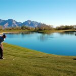 Fairway wrapping around the lake on the golf course at the Stone Canyon Club in Tucson Arizona