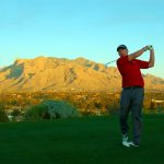 Playing golf on the OMNI Tucson National Golf Course in Tucson, Arizona with Mountains