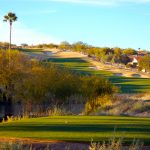 Golf green at the bottom of a hill at the OMNI Tucson National Golf Course in Tucson, Arizona