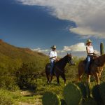 Starr Pass Golf Club - Riding horses through the desert at the base of the mountains in the Tucson Arizona golf home community