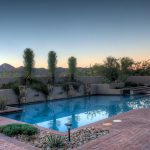 View of the mountains over the pool of this luxury golf home in Tucson Arizona