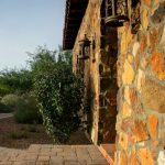 Stone wall entry to the luxury golf home in Tucson Arizona