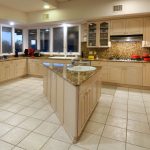 Gourmet kitchen complete with island and granite counters in a luxury golf home in Tucson, Arizona