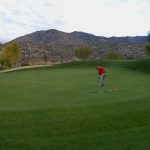 Golfer putting on a green at the Preserve in Saddlebrooke in Tucson Arizona
